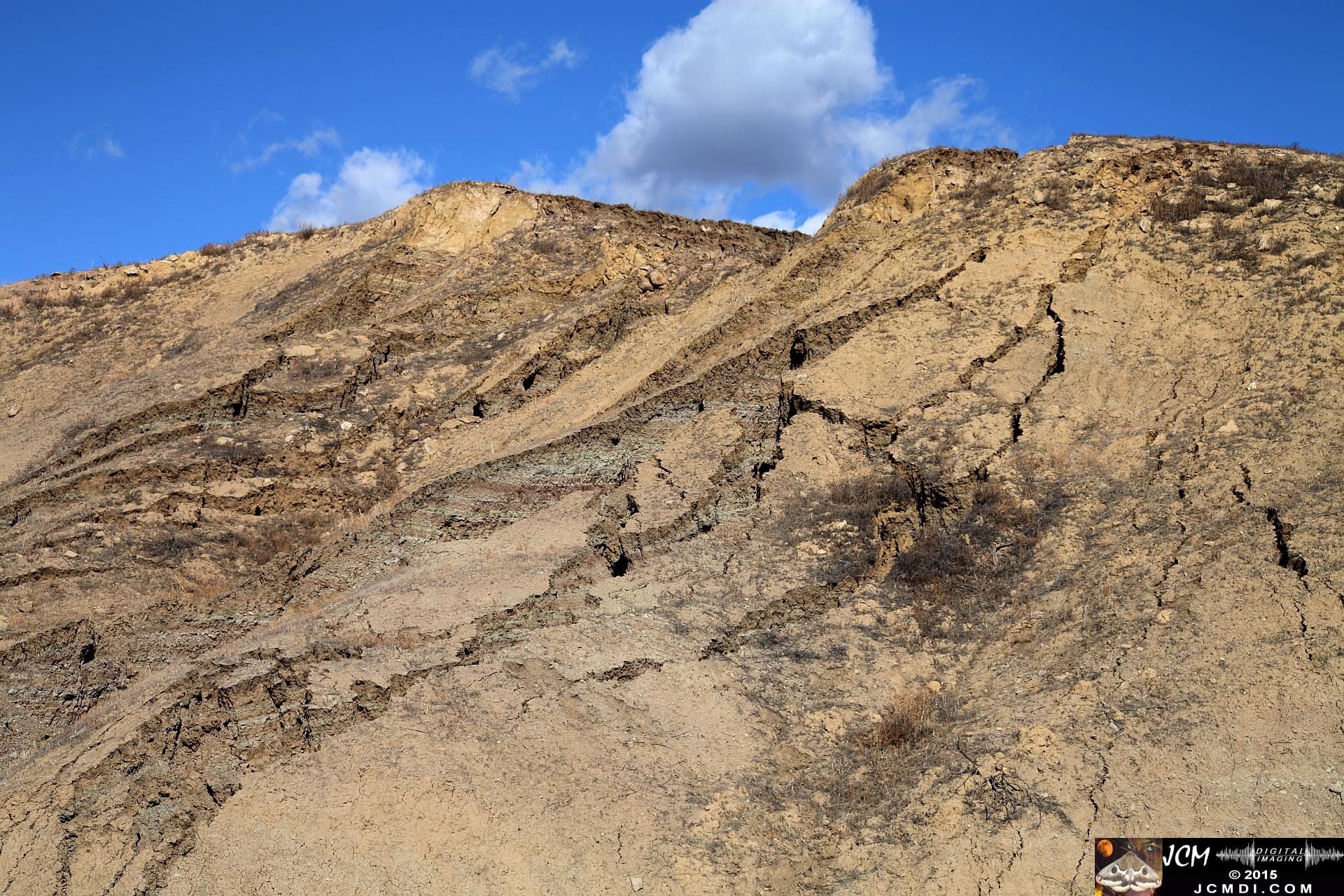 Landslide, buckled pavement, and terrain at Vasquez Canyon Road in Santa Clarita, CA filmed 11-25-2015